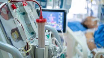 Priming the dialysis machine.