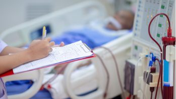 Examining the pre-dialysis weight of the patient and calculating the exact amount of water to be removed.